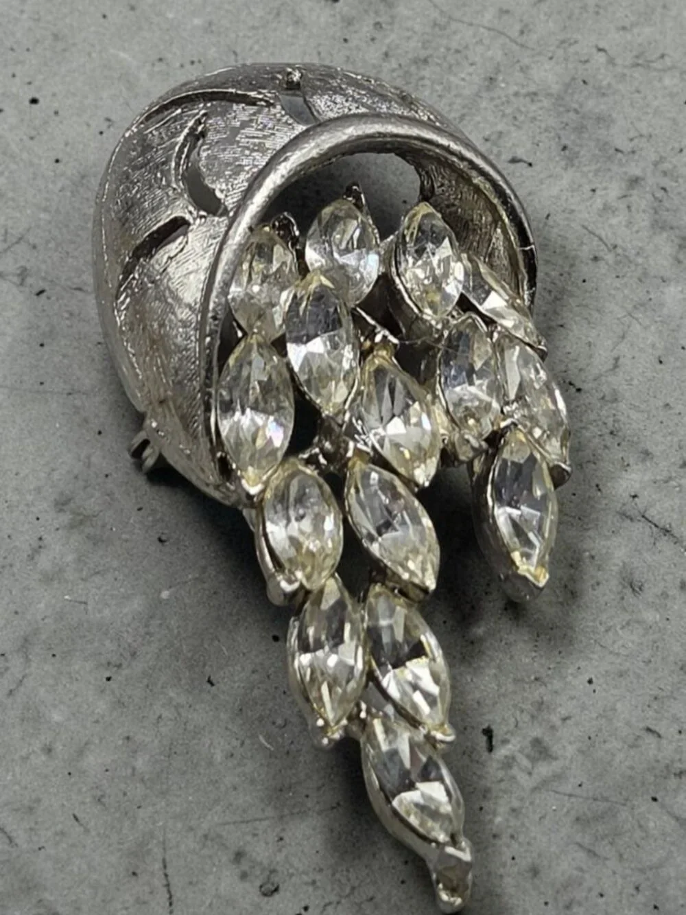 None this brooch